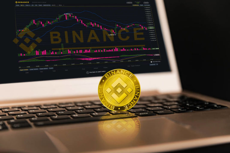 Buying Binance coin in the UK using a laptop