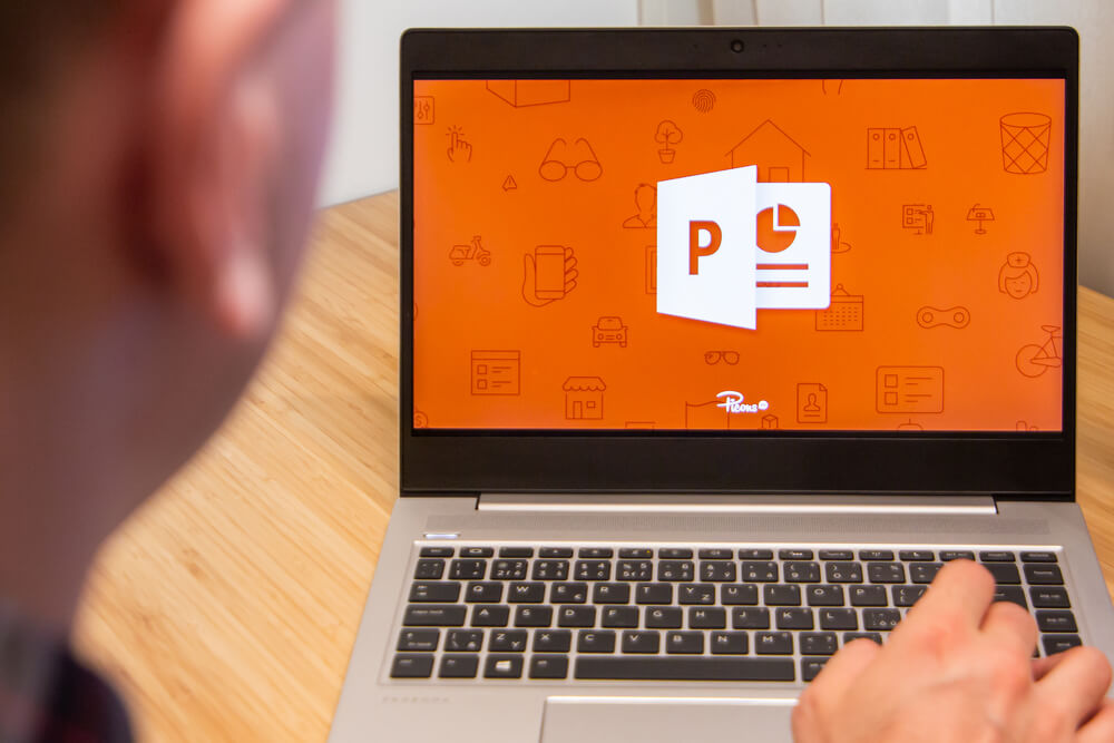PowerPoint is used by a man on the laptop