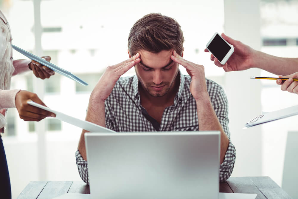 Man getting stressed becuase of excessive work